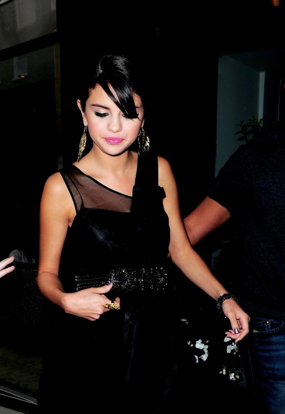 Selena Gomez in Black Dress Leaves Her Hotel in London