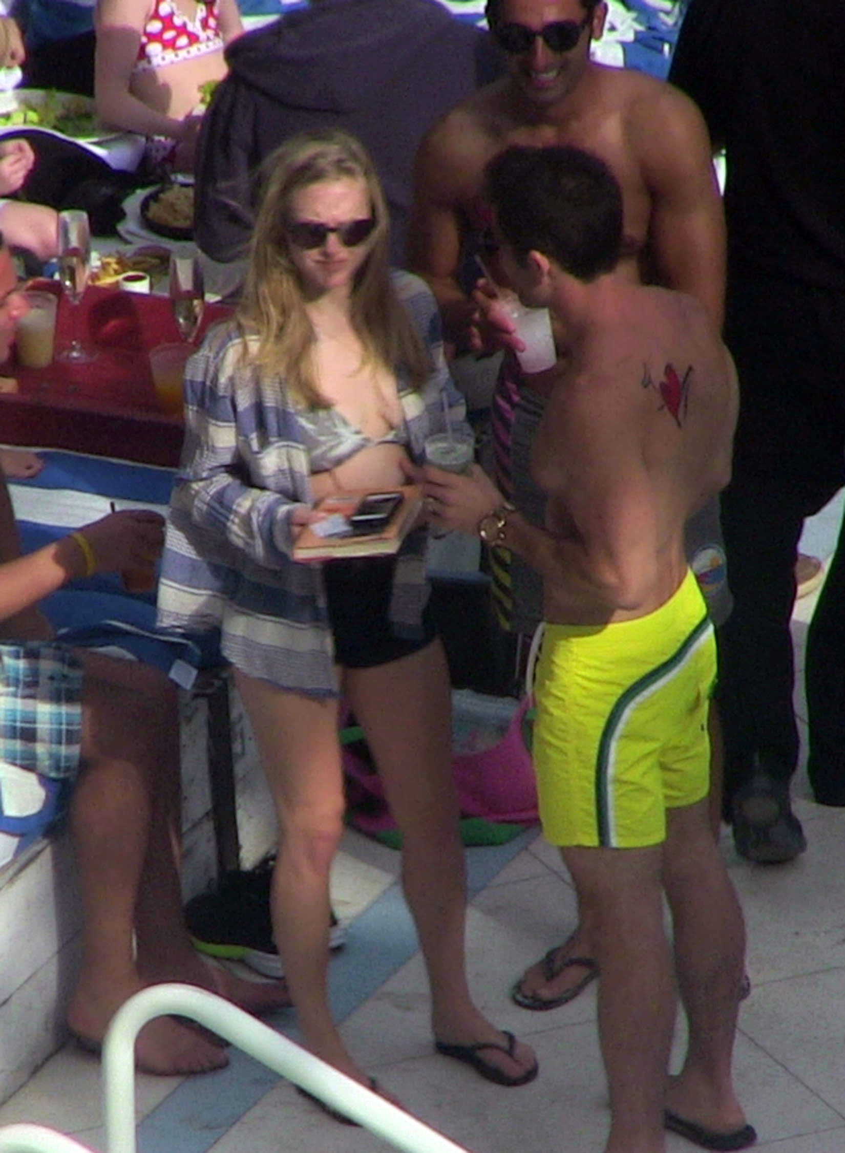 Amanda Seyfried - Bikini Top Candids at a pool in Miami. 