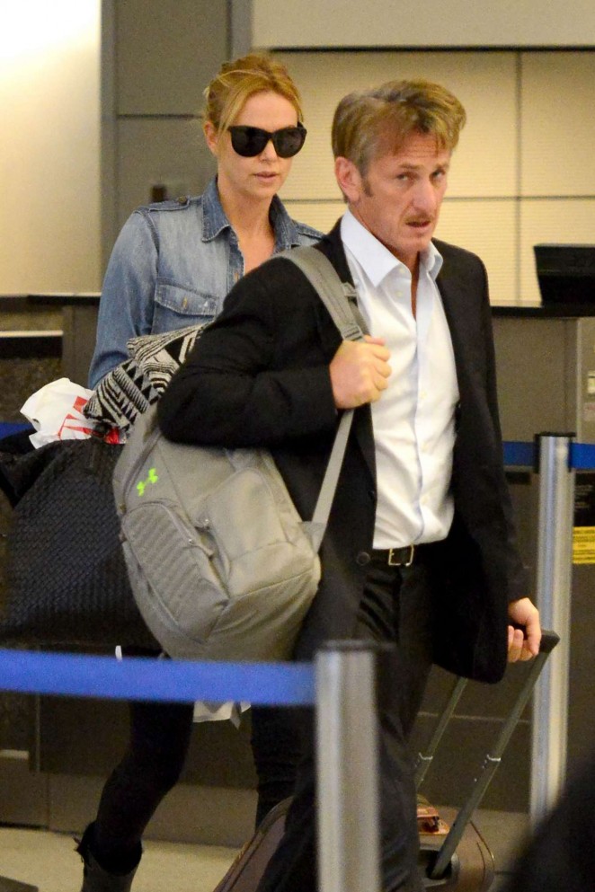 Charlize Theron and Sean Penn are kissing on LAX Airport in Los Angeles