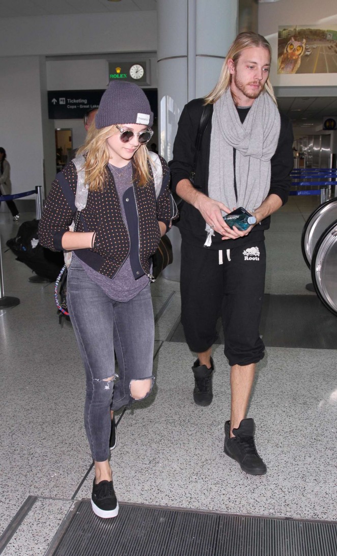 Chloe Moretz in Ripped Jeans - Arriving at LAX Airport in Los Angeles