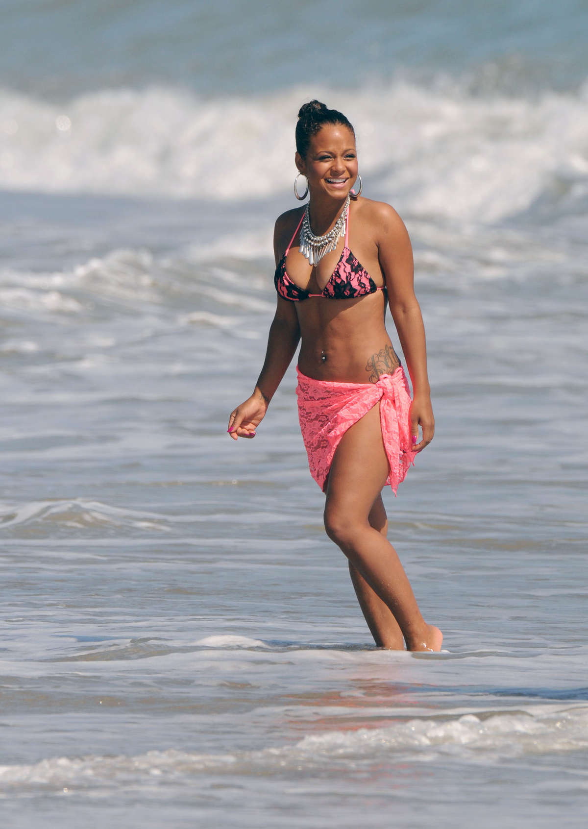 Christina Milian - Bikini Candids at a beach in Malibu. 