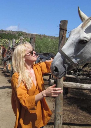 Dakota Johnson Riding Horse at Equestrian Center of Pantelleria in Italy