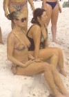Demi Moore covered in mud in bikini