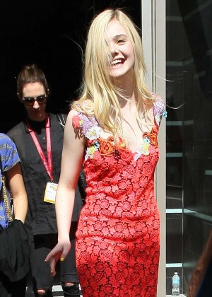 Elle Fanning in red dress leaving the Hard Rock Hotel in San Diego