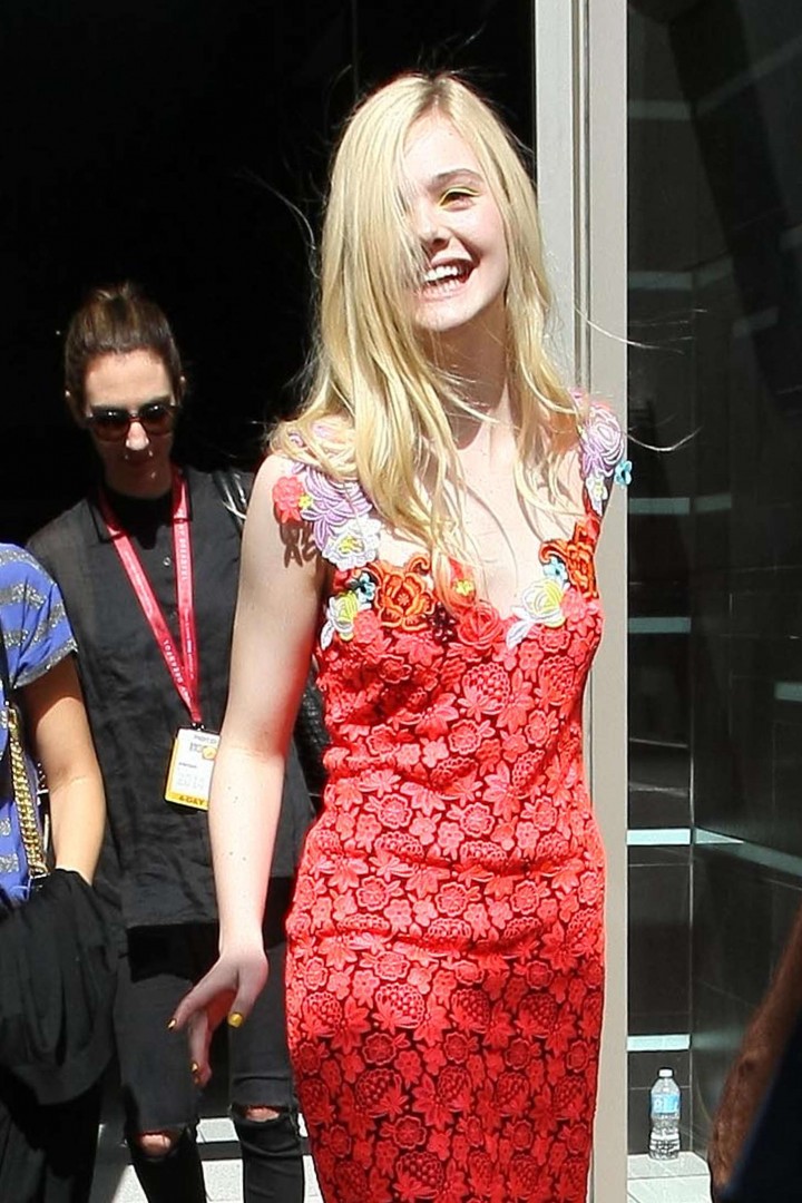 Elle Fanning in red dress leaving the Hard Rock Hotel in San Diego