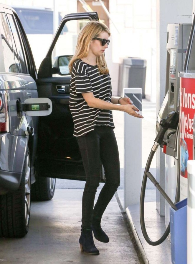 Emma Roberts in Jeans pumping gas in Hollywood