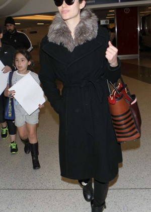 Emmy Rossum in Black Coat Arrives at LAX Airport in LA