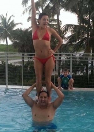 Eva Longoria in Red Bikini at a pool in Miami