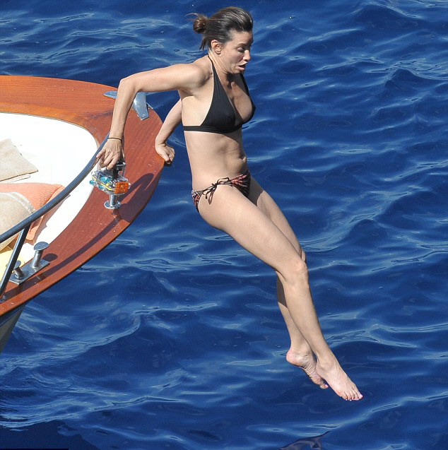 Gina Gershon - Bikini candids on a boat in Italy. 