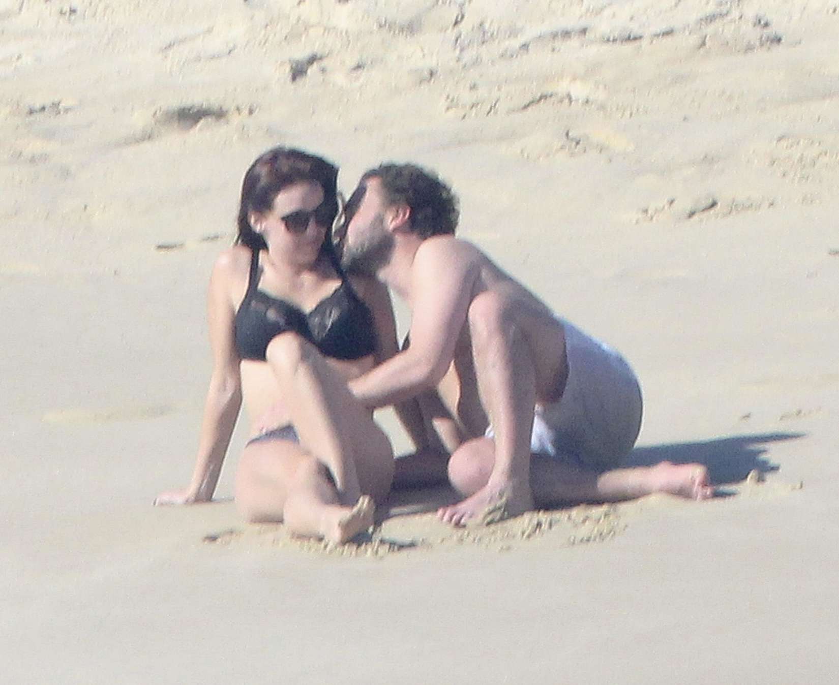 Kelli Garner - Wearing a bikini at a beach in Mexico. 