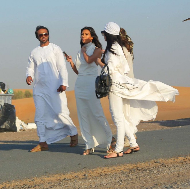 Kim Kardashian Walks The Desert in Dubai With Her Glam Squad