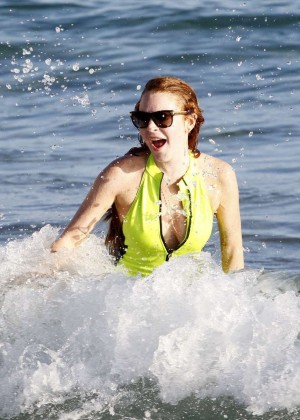 Lindsay Lohan In Neon Yellow Swimsuit at a beach in Ibiza