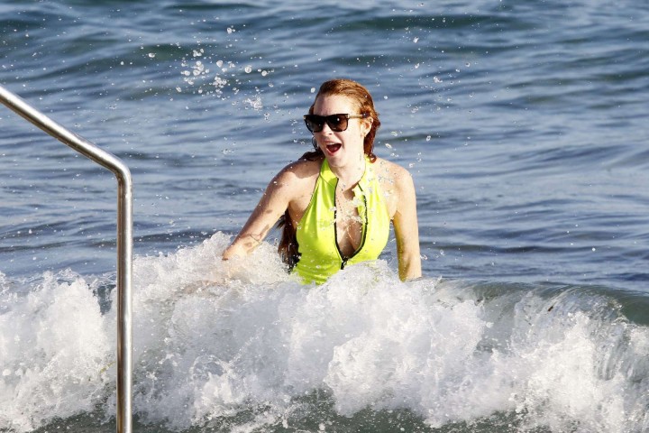 Lindsay Lohan In Neon Yellow Swimsuit at a beach in Ibiza