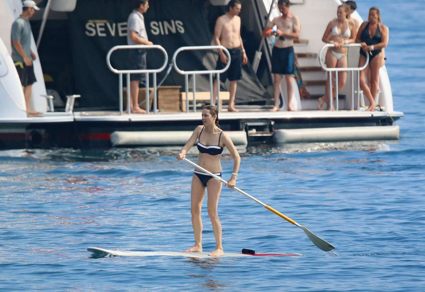 Marion Cotillard in Bikini Paddleboarding -01 GotCeleb