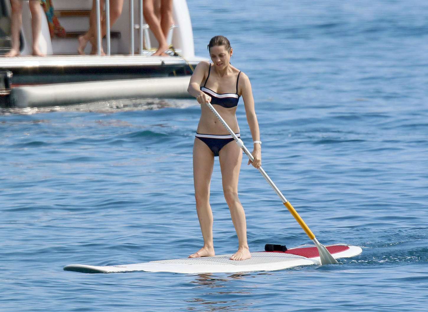 Marion Cotillard in Bikini Paddleboarding. 