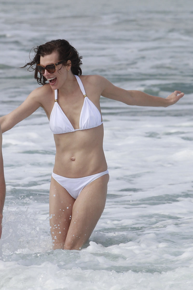 Milla Jovovich in white bikini in Hawaii. 