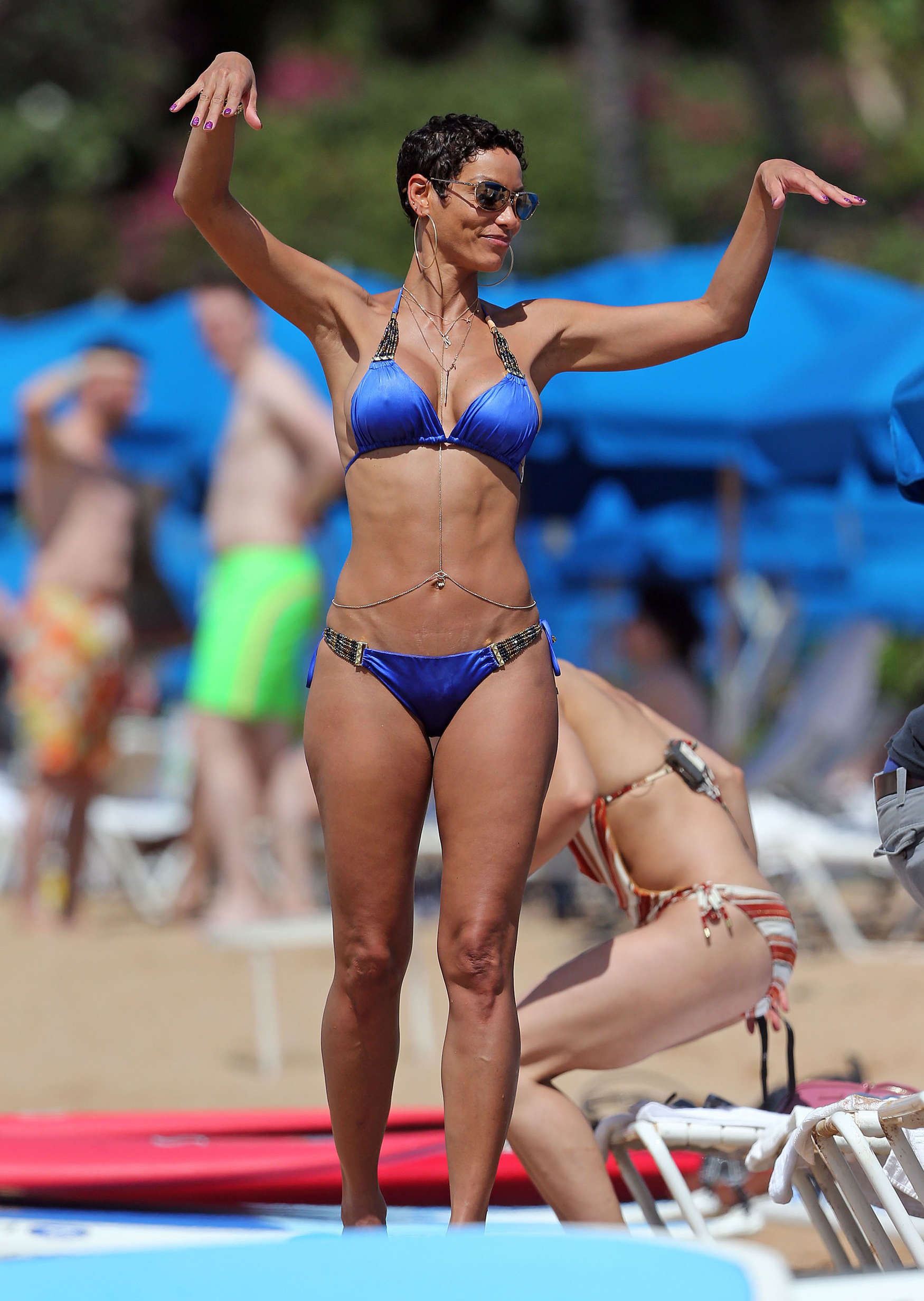 Nicole Murphy - Paddleboarding in royal blue two-piece bikini in Maui. 