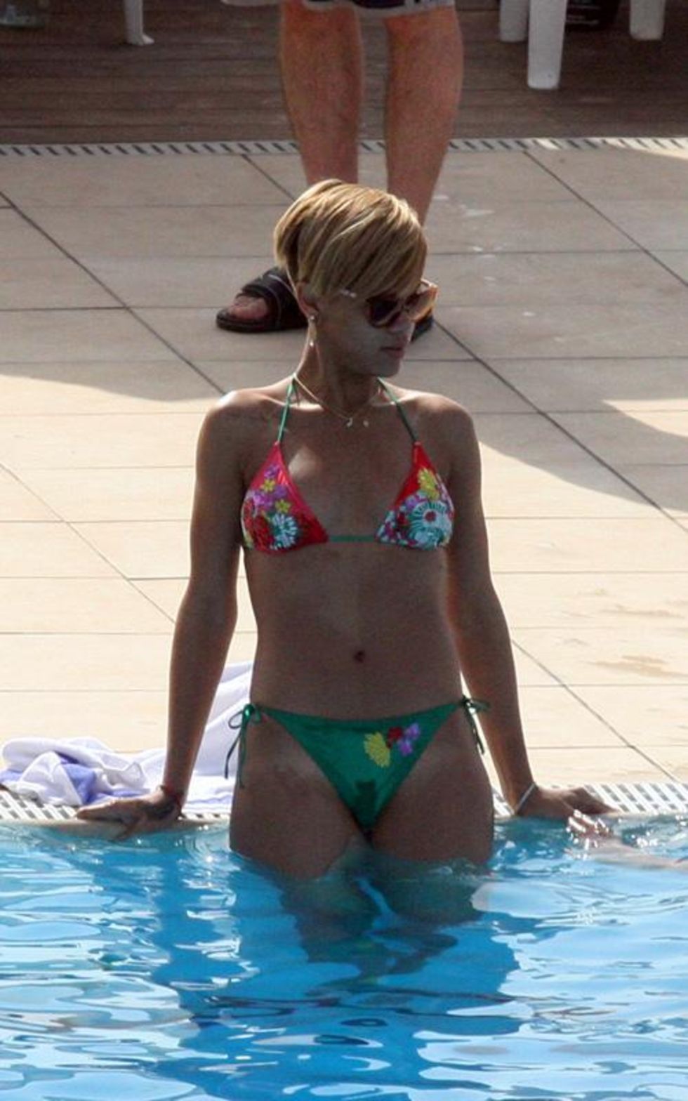 Rihanna In A Bikini - pool candids in Tel Aviv - May 2010.