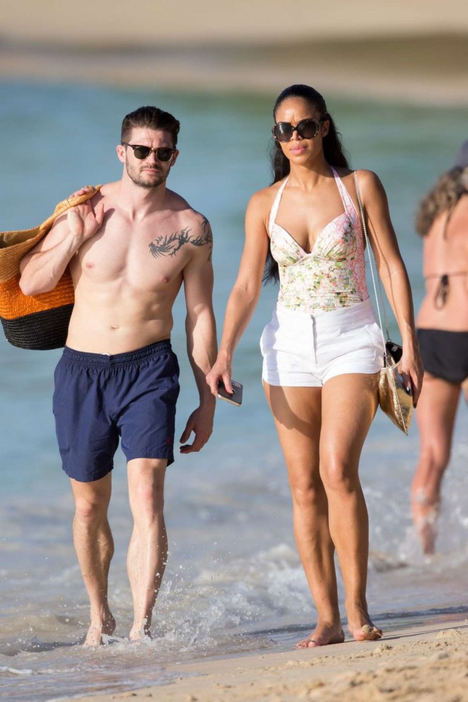 Sarah-Jane Crawford in Swimsuit and Shorts on The Beach in Barbados