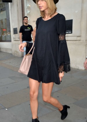 Taylor Swift in a black mini dress out in London