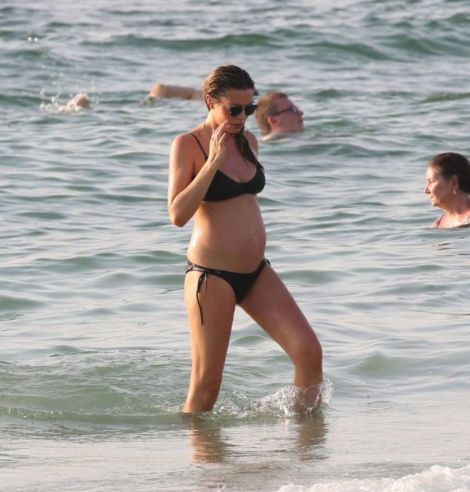 Abbey Clancy in Black Bikini on the beach in Dubai