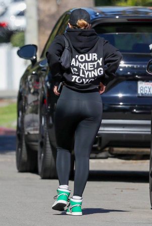 Addison Rae - Show 'Your Anxiety Is Lying To You' message on her back in West Hollywood