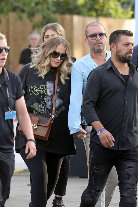 Adele - Holds Hands with a male Friend en Route to watch Celine Dion in London