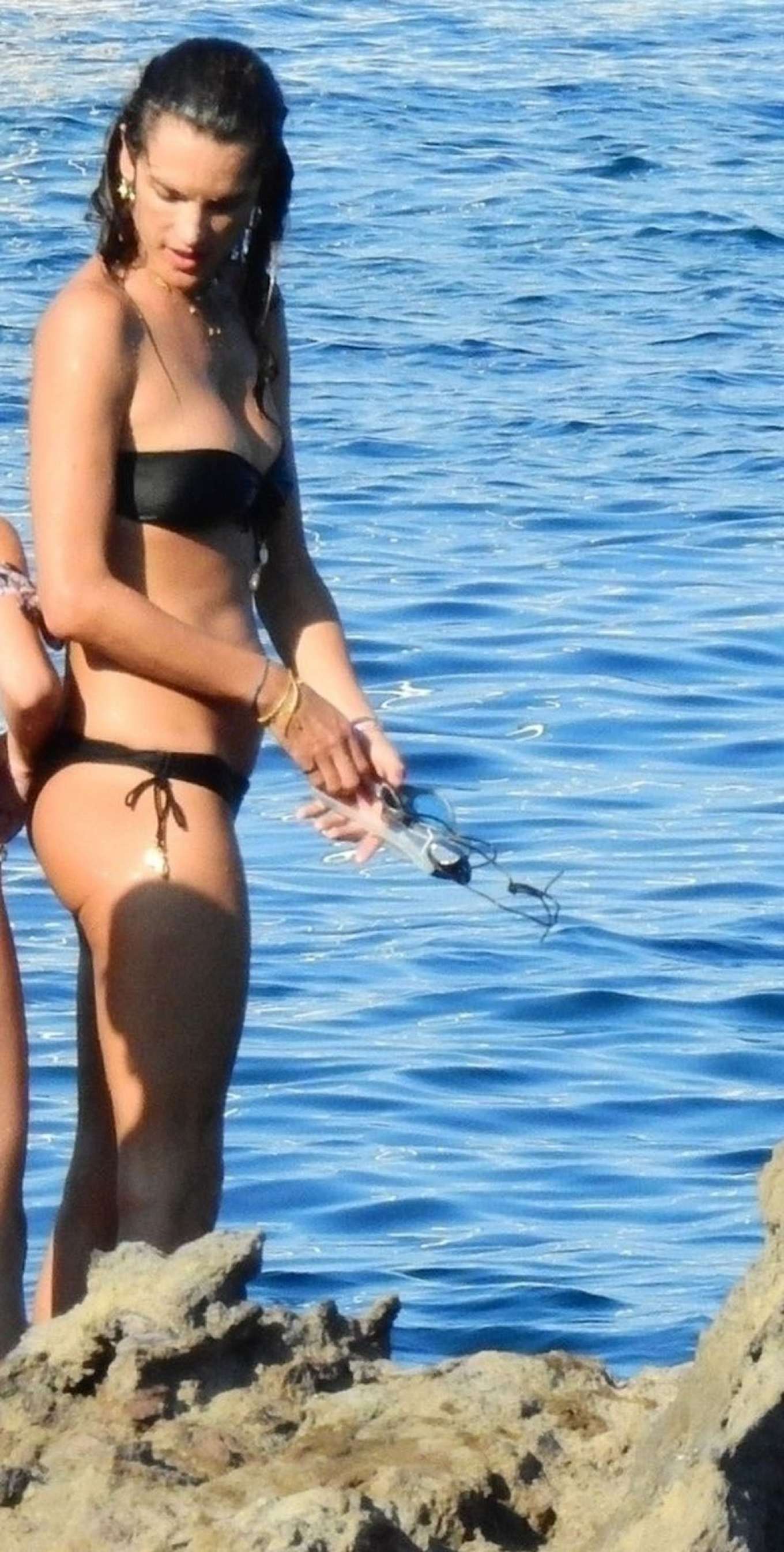 Alessandra Ambrosio in Black Bikini on the beach in Eden Garden