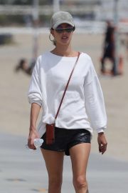 Alessandra Ambrosio - In leather shorts walking along the beach in Santa Monica