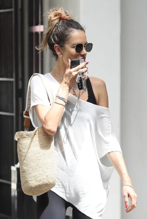 Alessandra Ambrosio - Rocks a Rolling Stones t-shirt while shopping with a friend in Brentwood