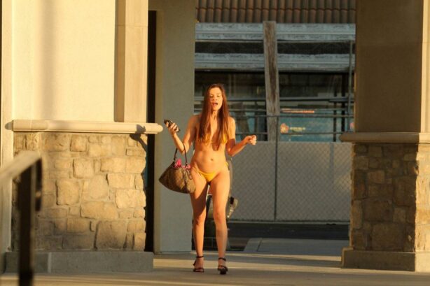 Alicia Arden - Heads to a tanning salon in a yellow bikini