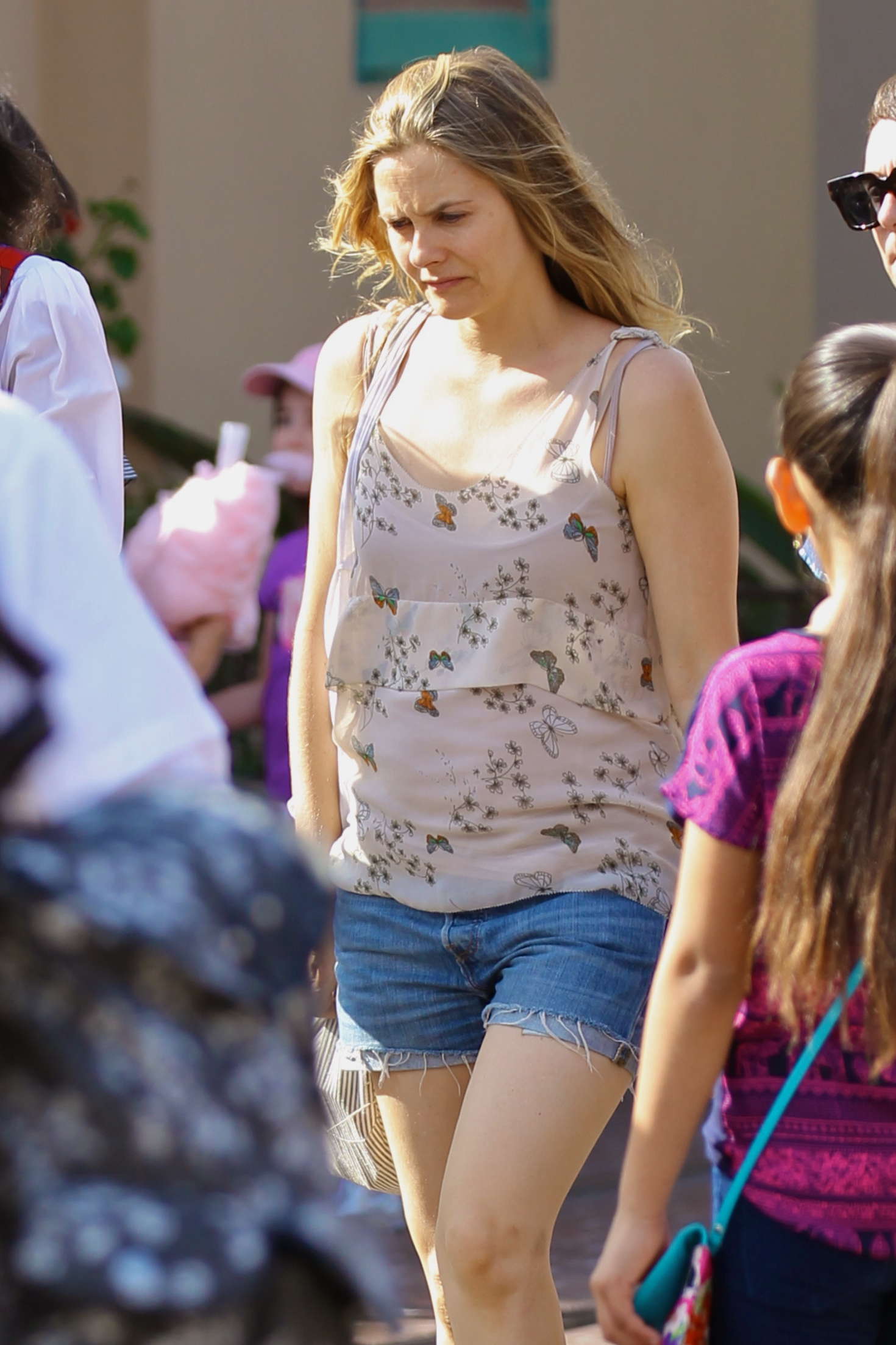 Alicia Silverstone in Jeans Shorts on Disneyland in Florida