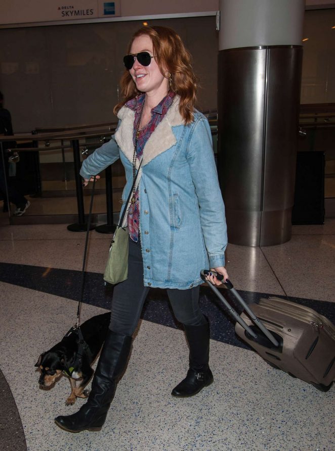 Alicia Witt with her dog at LAX airport in Los Angeles
