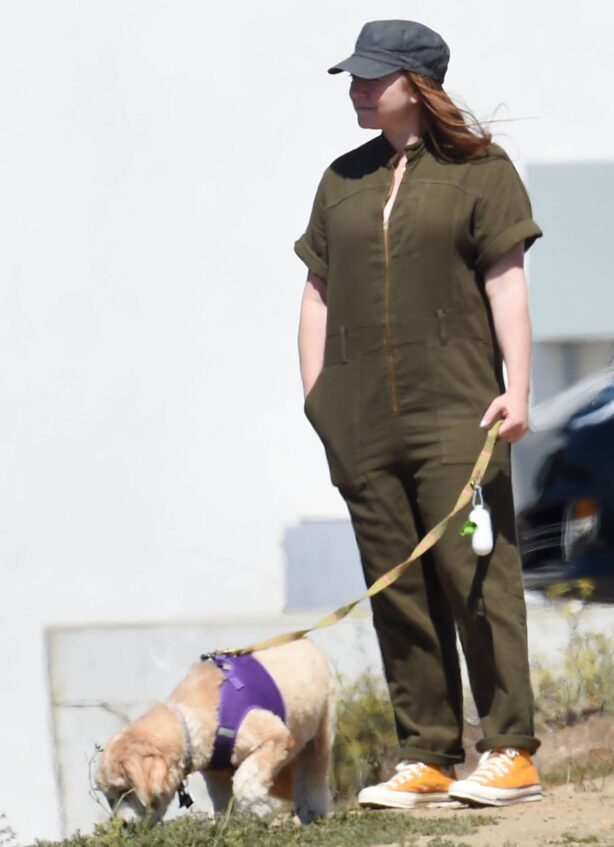 Alyson Hannigan - Wearing a green jumpsuit and yellow converse high tops in Los Angeles