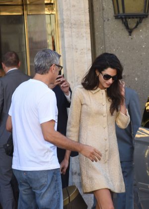 Amal and George Clooney leaving her hotel in Rome
