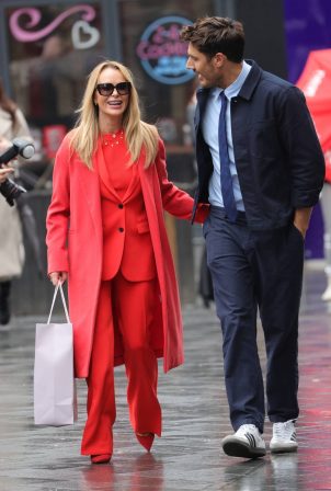 Amanda Holden - In a red trouser suit after a couple proposed on her show in London