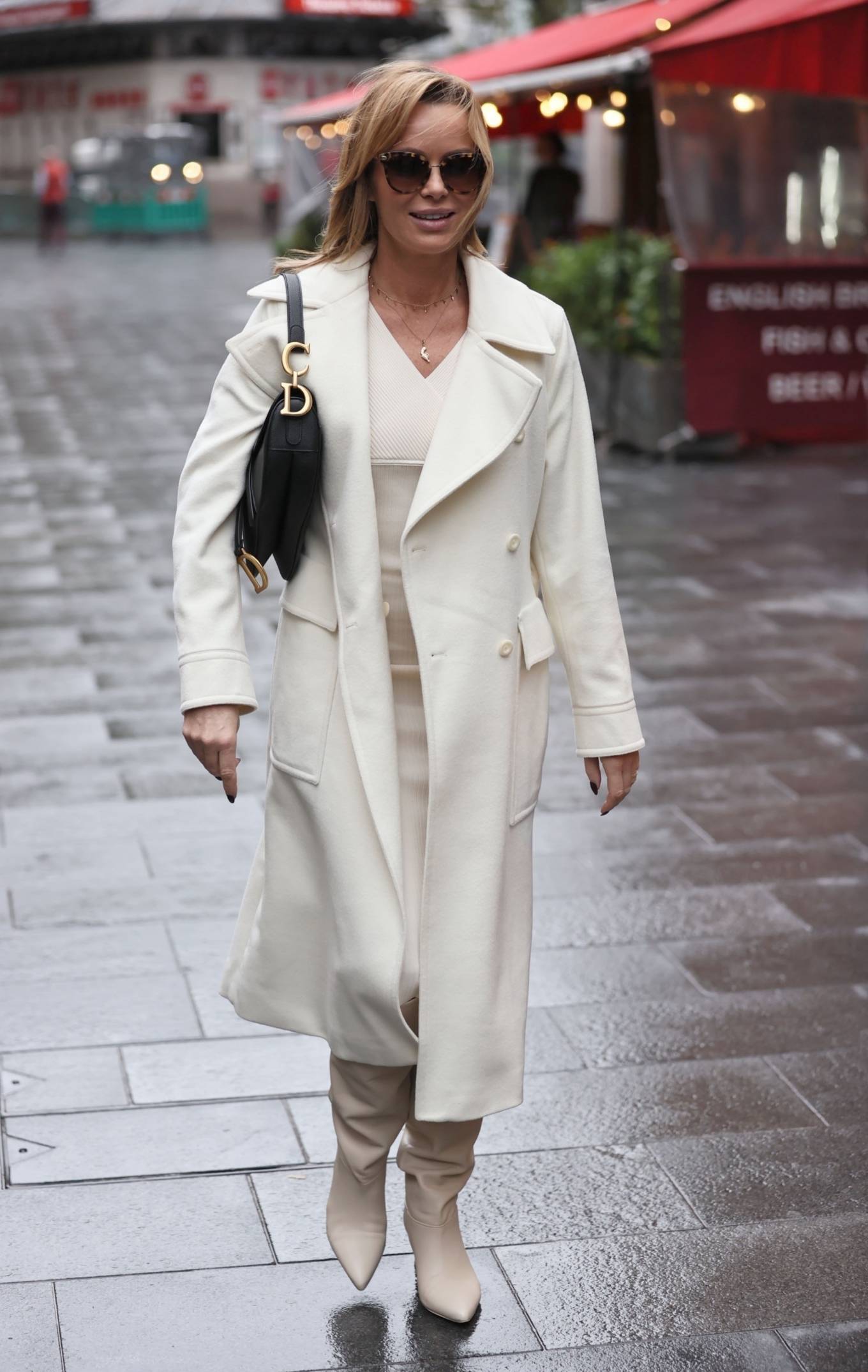 Amanda Holden – Looks chic in a cream dress and coat outside the Global ...