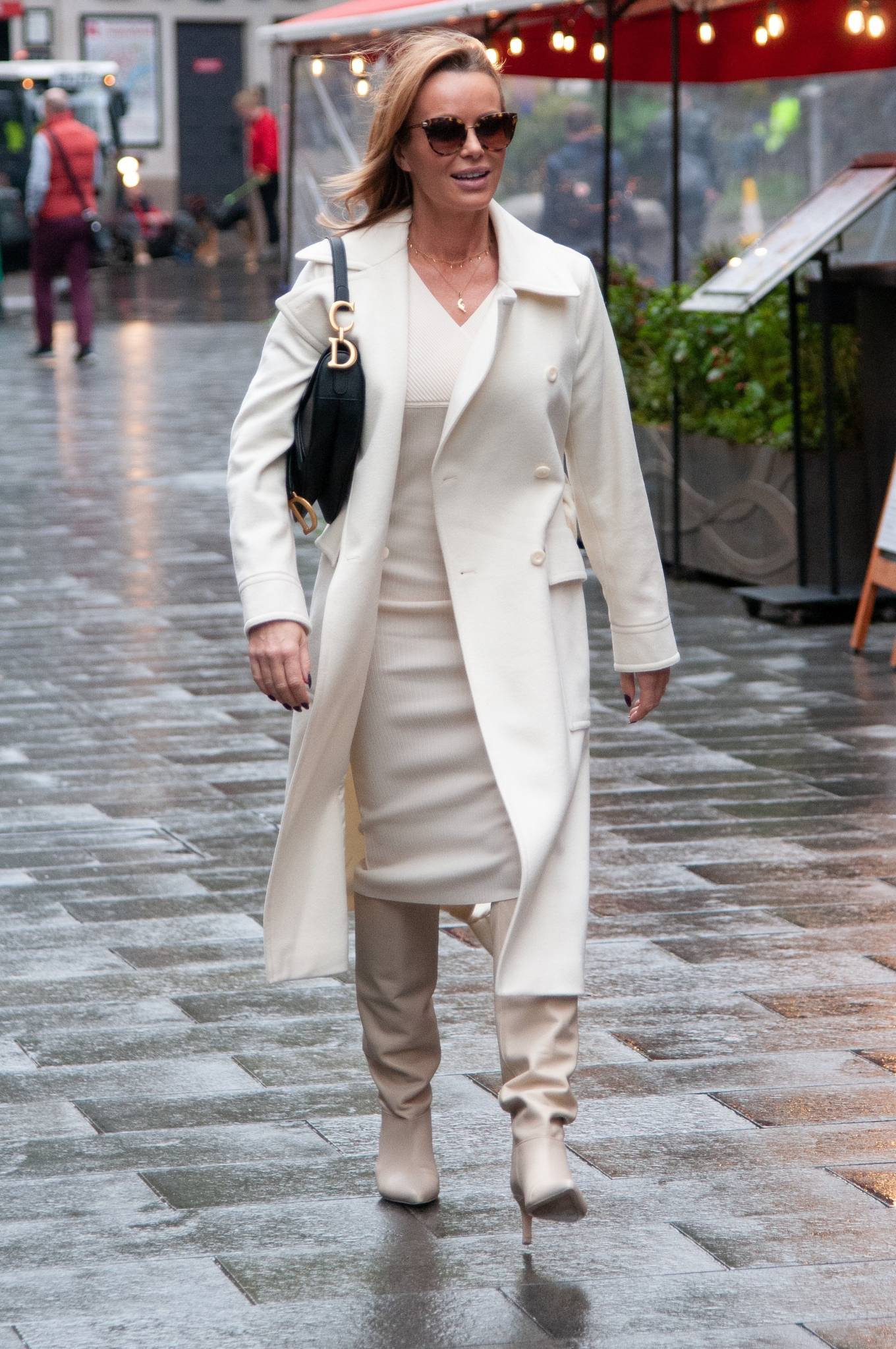 Amanda Holden – Looks chic in a cream dress and coat outside the Global ...