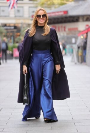 Amanda Holden - Wearing metallic blue flared trousers in London
