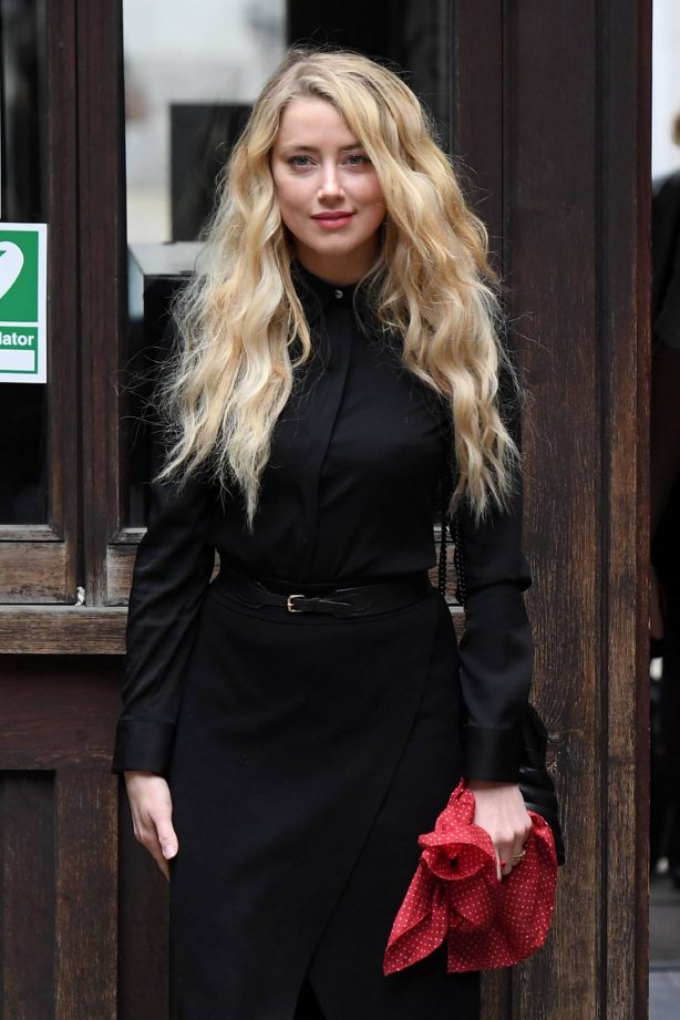 Amber Heard - All in black at the Royal Courts of Justice in London