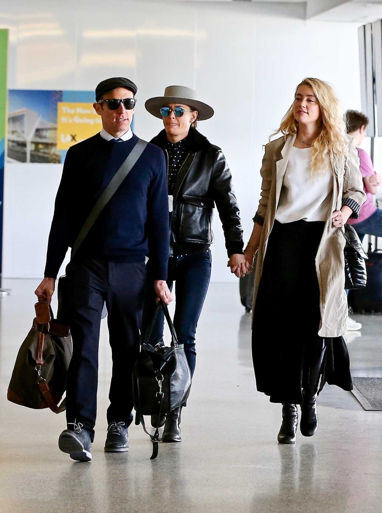 Amber Heard and Bianca Butti depart from LAX. 