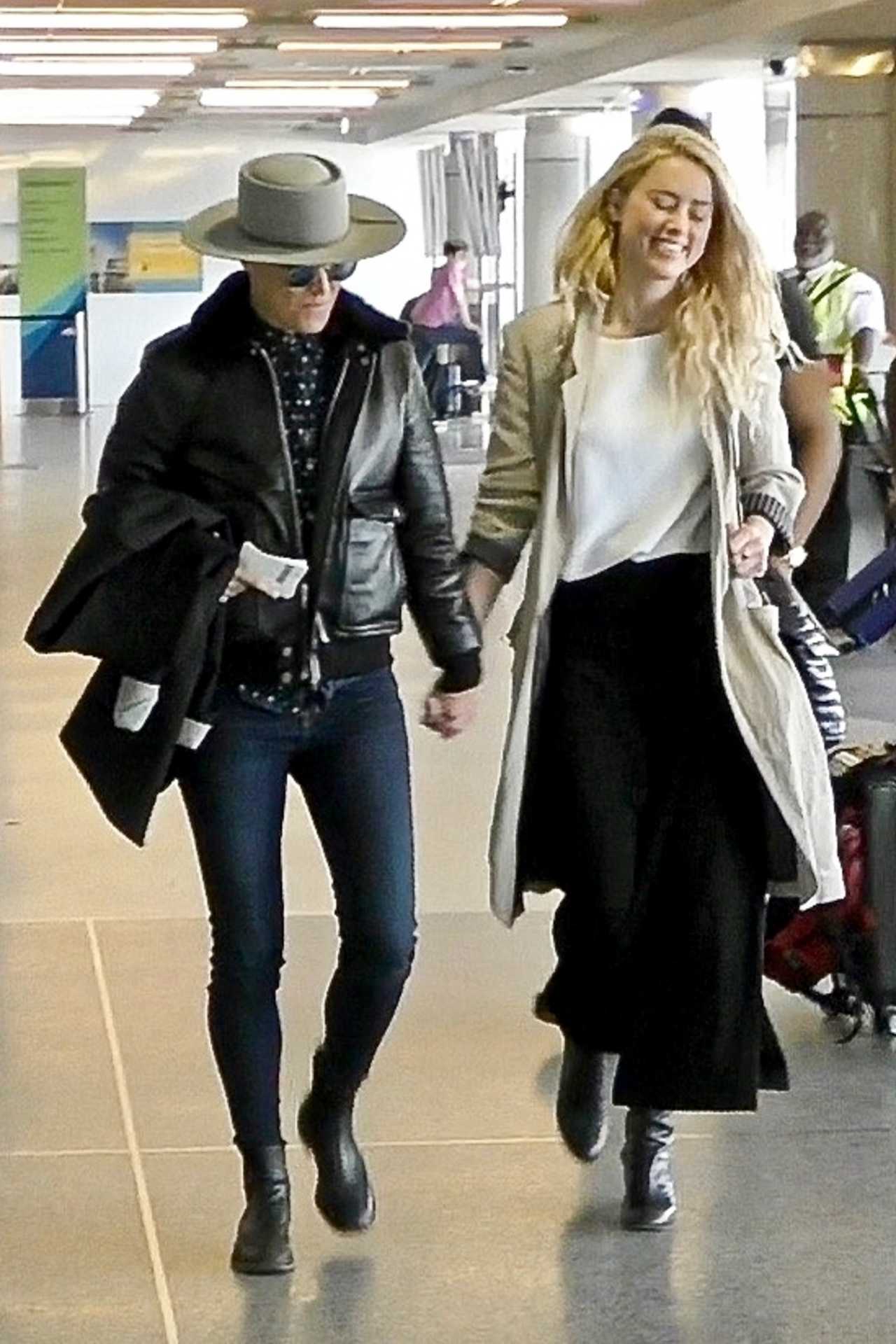 Amber Heard and Bianca Butti depart from LAX. 