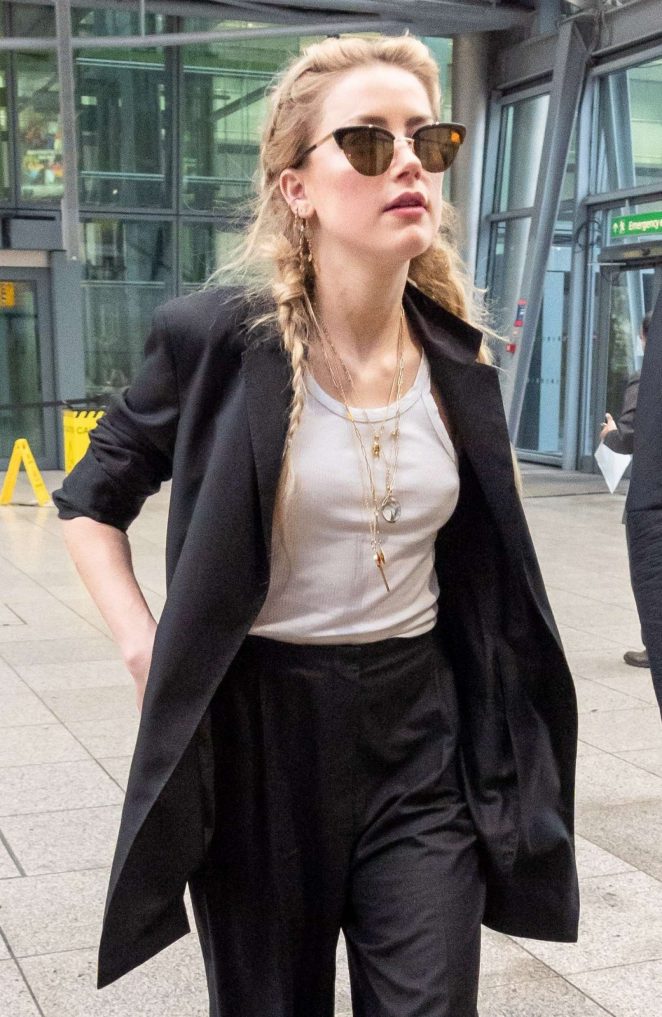 Amber Heard - Arrives at Heathrow Airport in London
