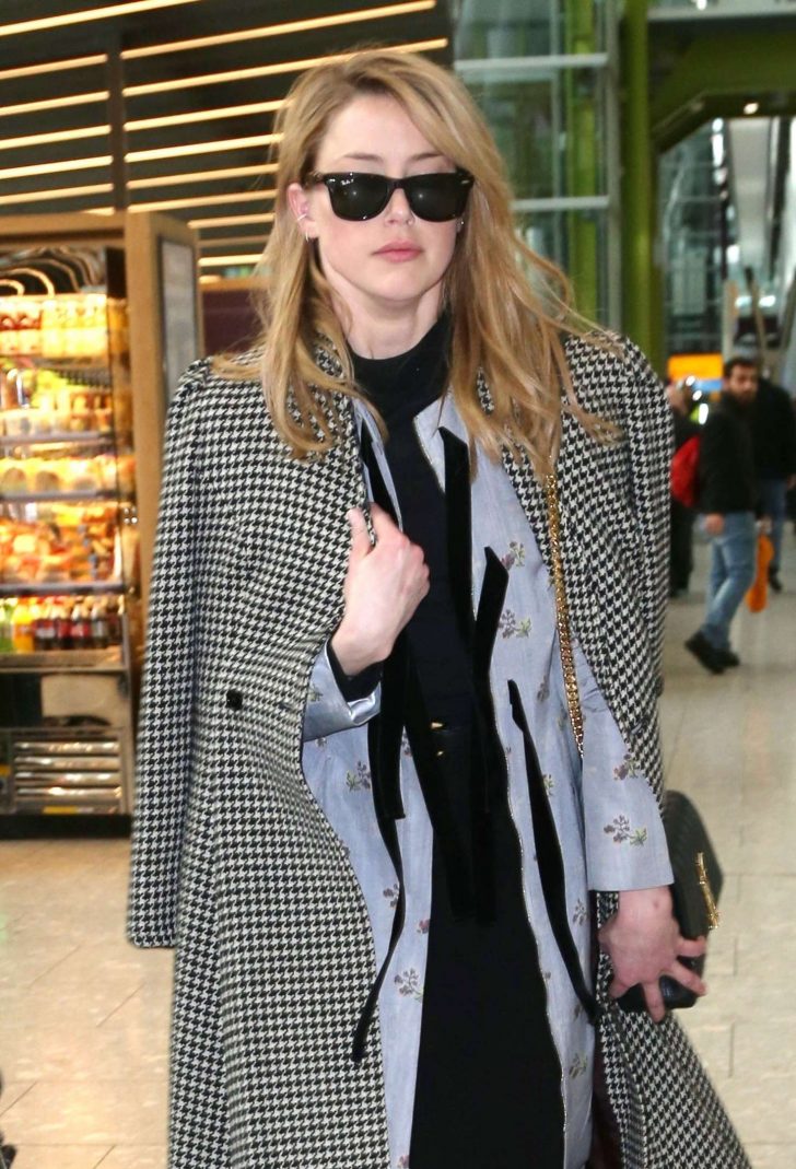 Amber Heard - Arriving at Heathrow Airport in London