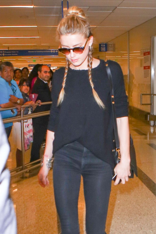 Amber Heard in Black Jeans at LAX in Los Angeles