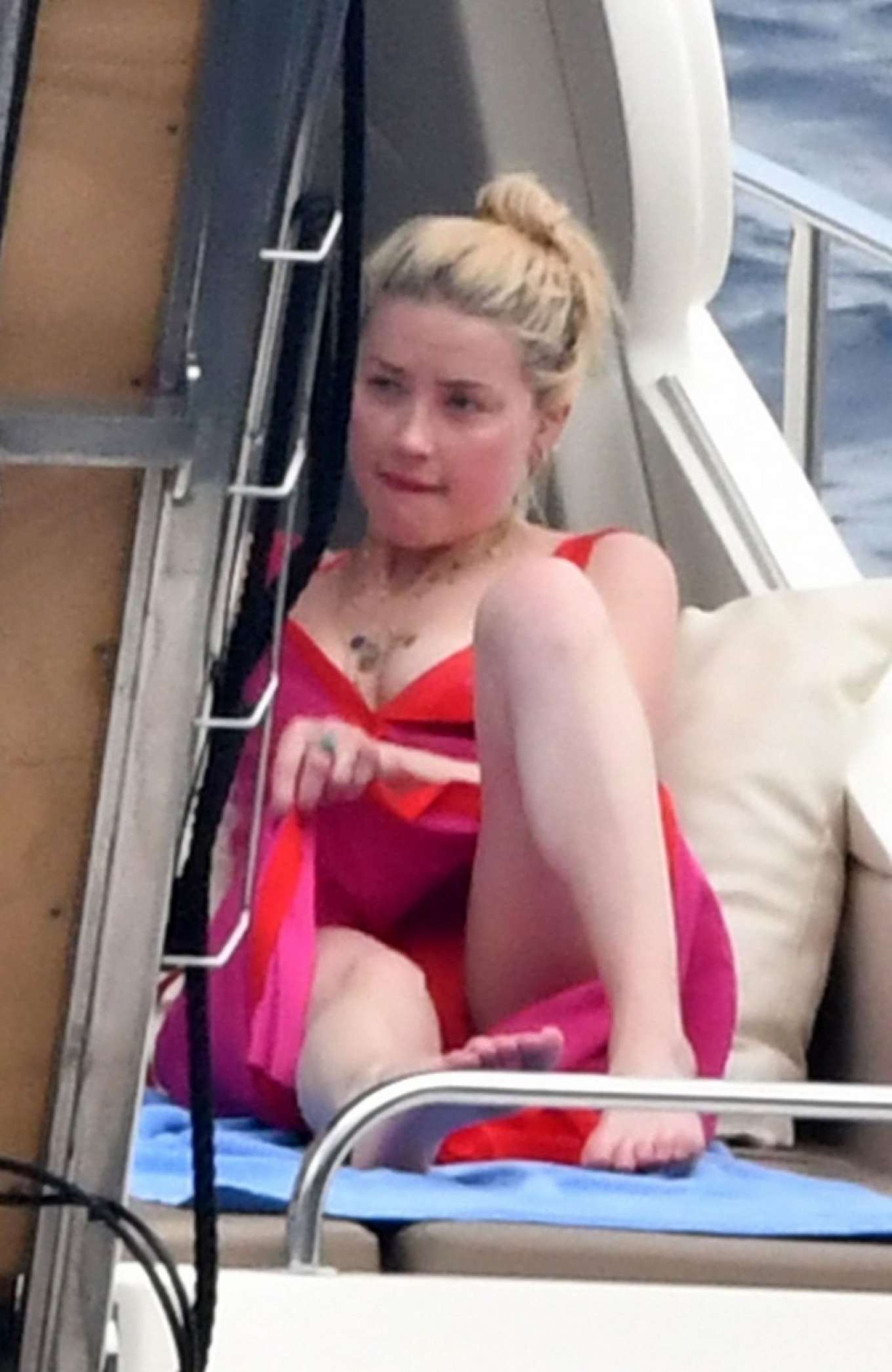 Amber Heard in Red Bikini at a yacht on the Amalfi Coast. 