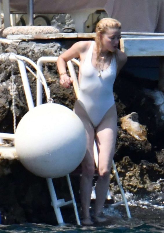 Amber Heard in White Swimsuit on holiday in Amalfi Coast