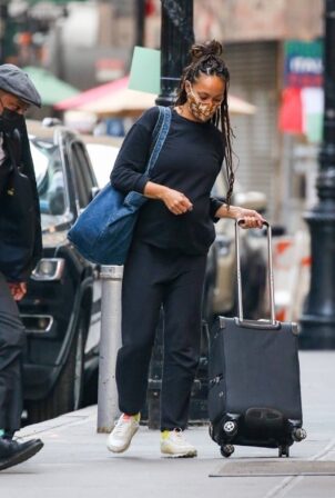 Amber Stevens West - Seen carrying her luggage while out in New York