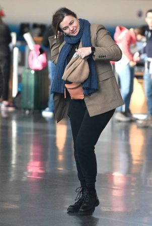 Amber Tamblyn - Catches a flight at JFK Airport in New York
