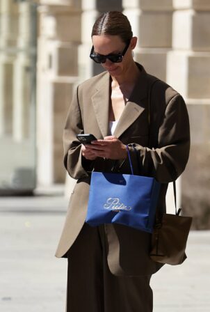 Amber Valletta - Leaving hotel Ritz in Paris wearing Loewe bag and Off-White sneakers